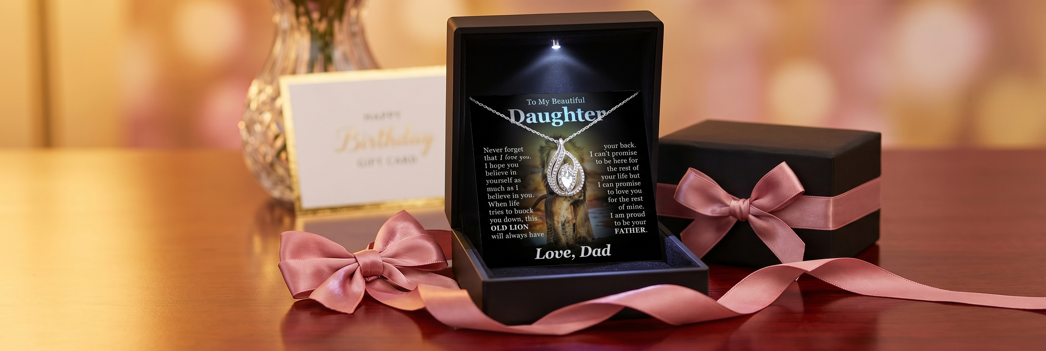 Elegant message card necklace gift for daughter displayed in a luxury jewelry box with soft golden light