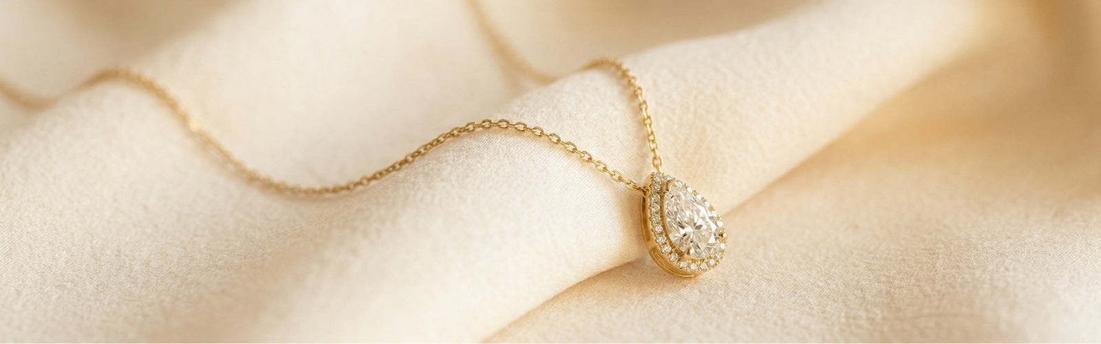 Elegant necklace displayed on soft luxury background, minimal style, warm lighting, premium jewelry